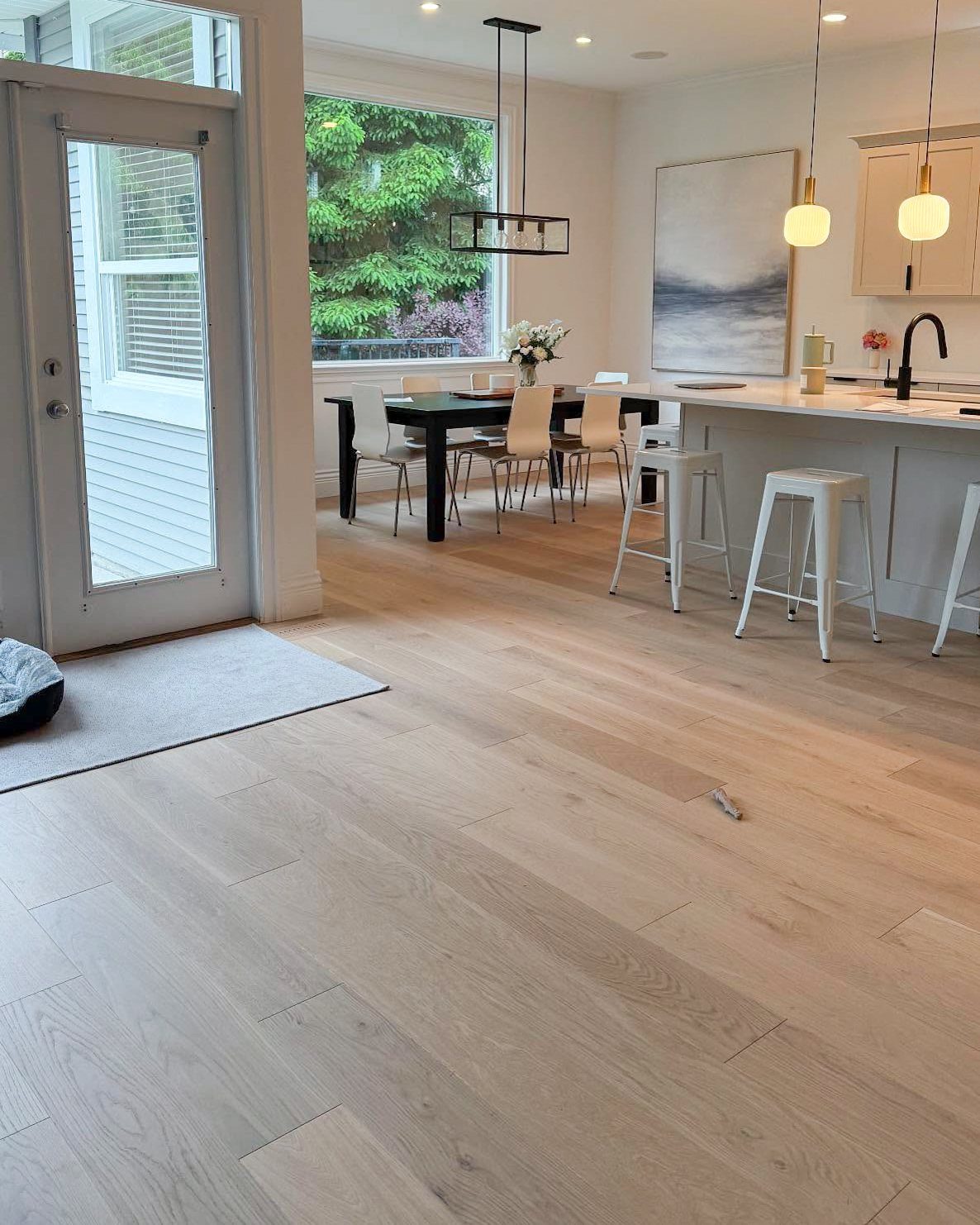 Cool Tone Wood Floors: 6 Mix-and-Match Ideas for Modern Matches 3 Light white oak hardwood flooring in a bright, modern open-concept home interior.