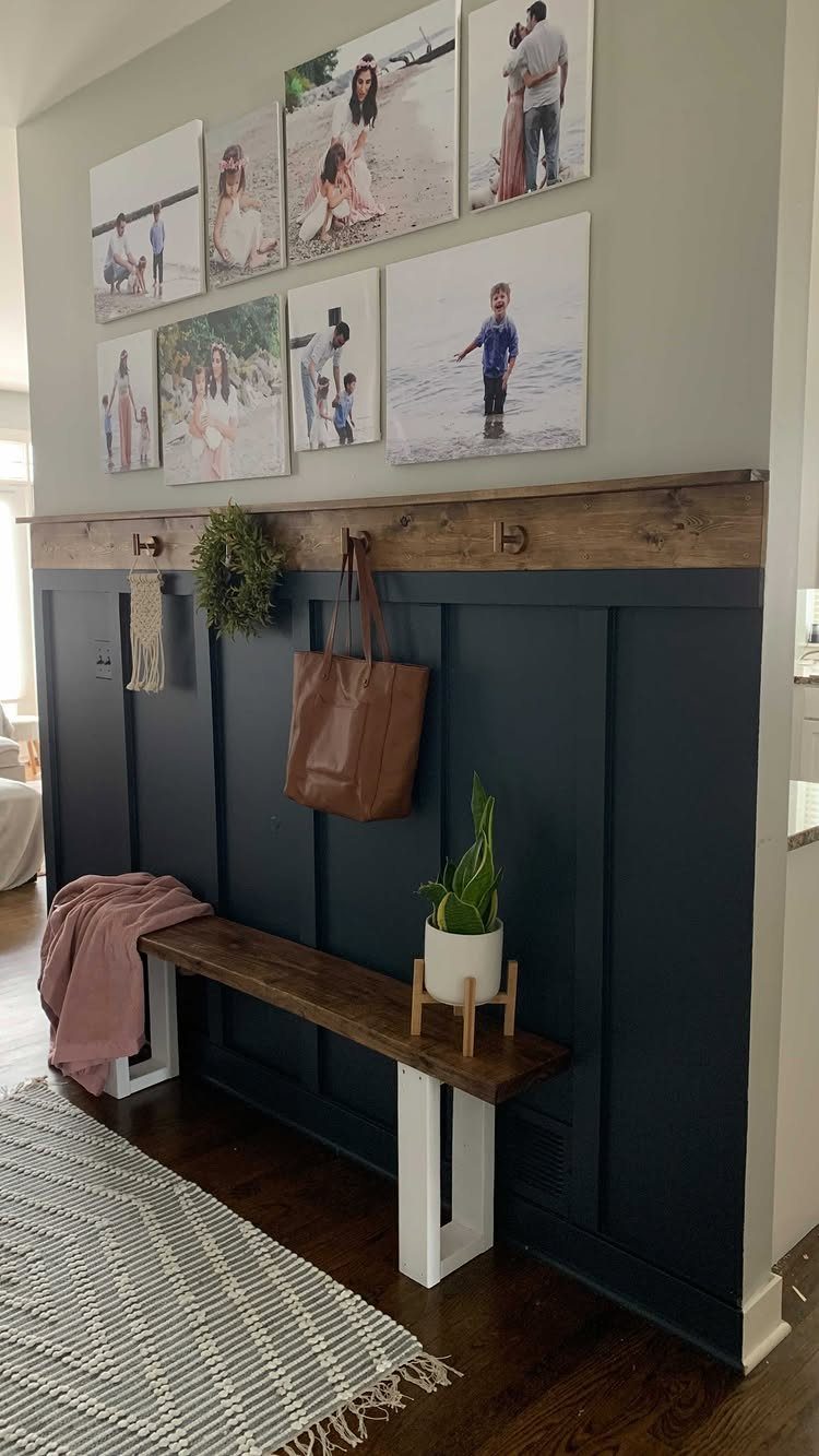 Decorative Wall Molding: 7 Panel Styles for Every Room 1 Dark blue board and batten wall paneling with a wooden shelf and hanging accessories.
