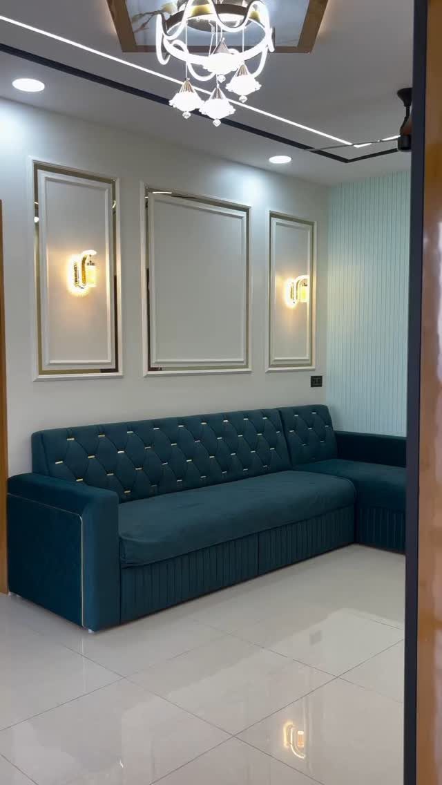 Decorative Wall Molding: 7 Panel Styles for Every Room 6 Three gold-trimmed rectangular wall moldings mounted on a white wall above a teal sofa.