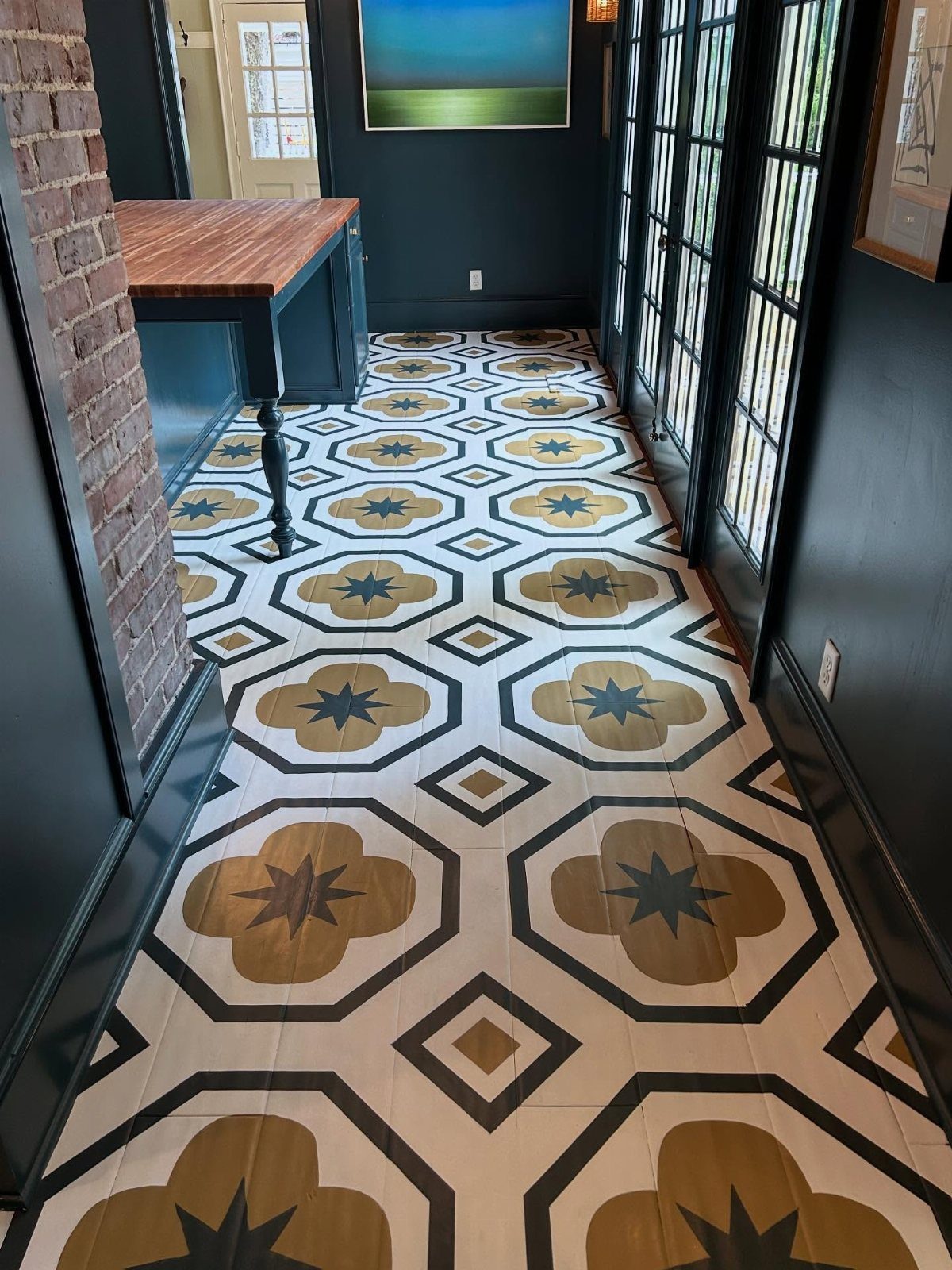 Kitchen Floor Colors: 14 Ideas for 2026 6 Patterned floor tiles with white, black, and mustard yellow geometric and floral designs in a hallway.