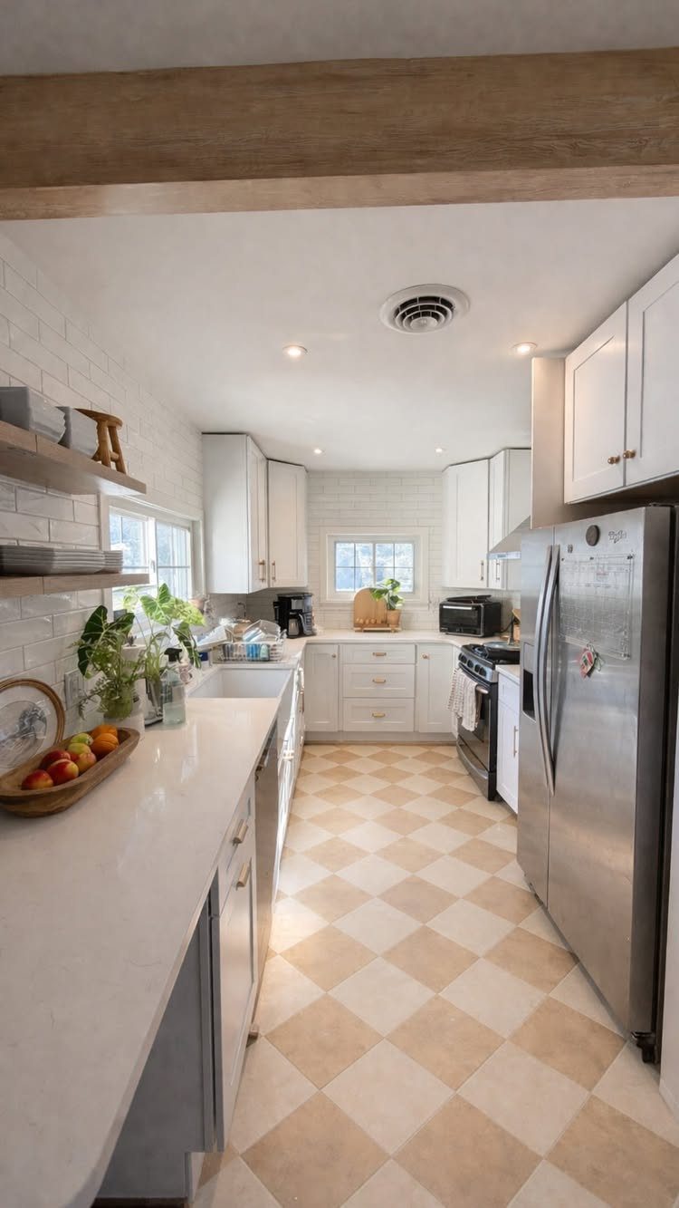 Kitchen Floor Colors: 14 Ideas for 2026 5 A kitchen with a beige and cream checkerboard pattern tile floor and white cabinets.