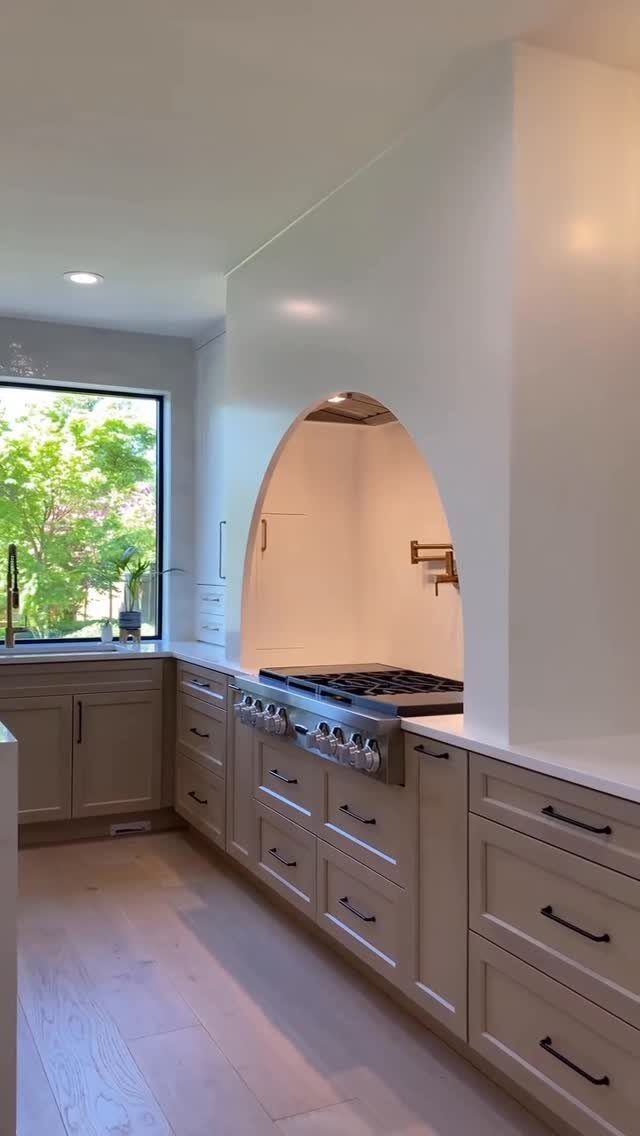 Kitchen Floor Colors: 14 Ideas for 2026 1 Light beige kitchen cabinets and flooring in a bright, modern kitchen setting.