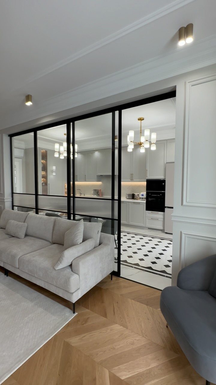 Kitchen Floor Colors: 14 Ideas for 2026 13 White kitchen tiles with black diamond patterns visible through glass sliding doors.