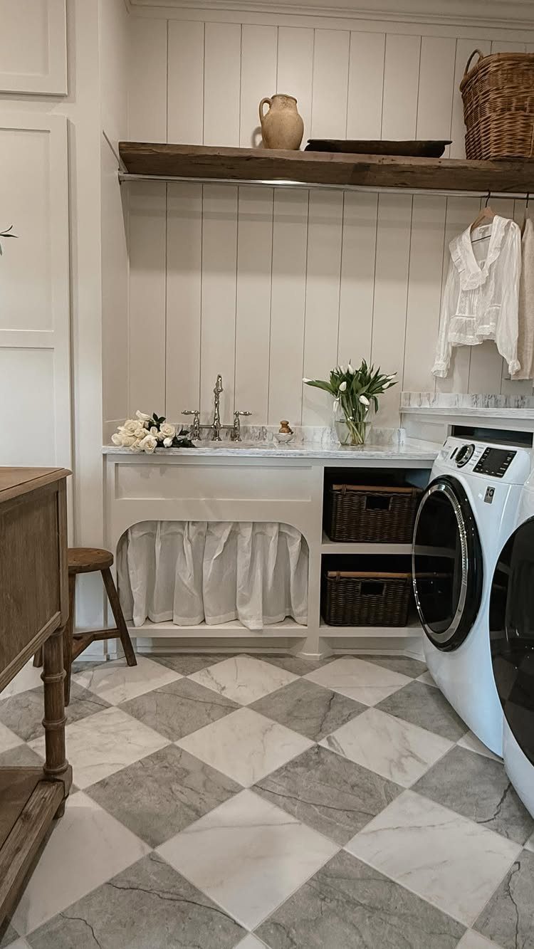 Checkered marble-patterned flooring in a bright, white laundry room with a washing machine.