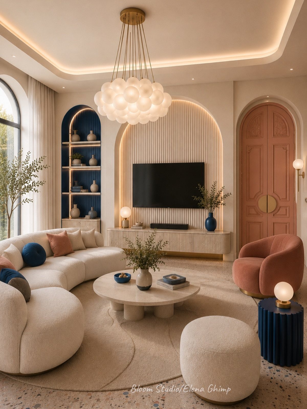 Modern living room with arched wall alcoves, a curved sofa, and a large bubble chandelier.