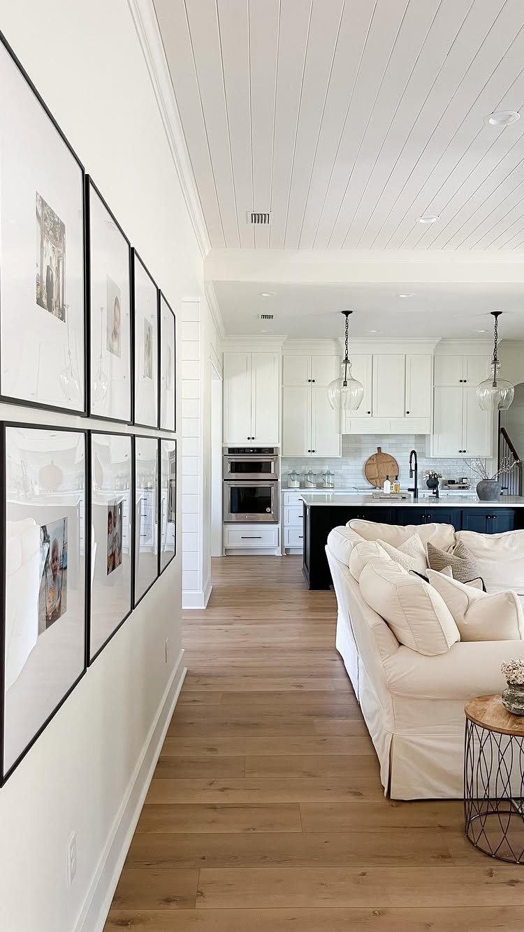 Most Popular Coretec Colors: 8 Best-Selling Flooring Picks 1 Light wood flooring in a bright, modern open-concept living room and kitchen area.
