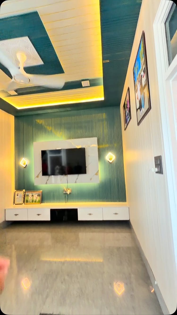 Teal vertical PVC panel wall design behind a white television mount in a modern living room.