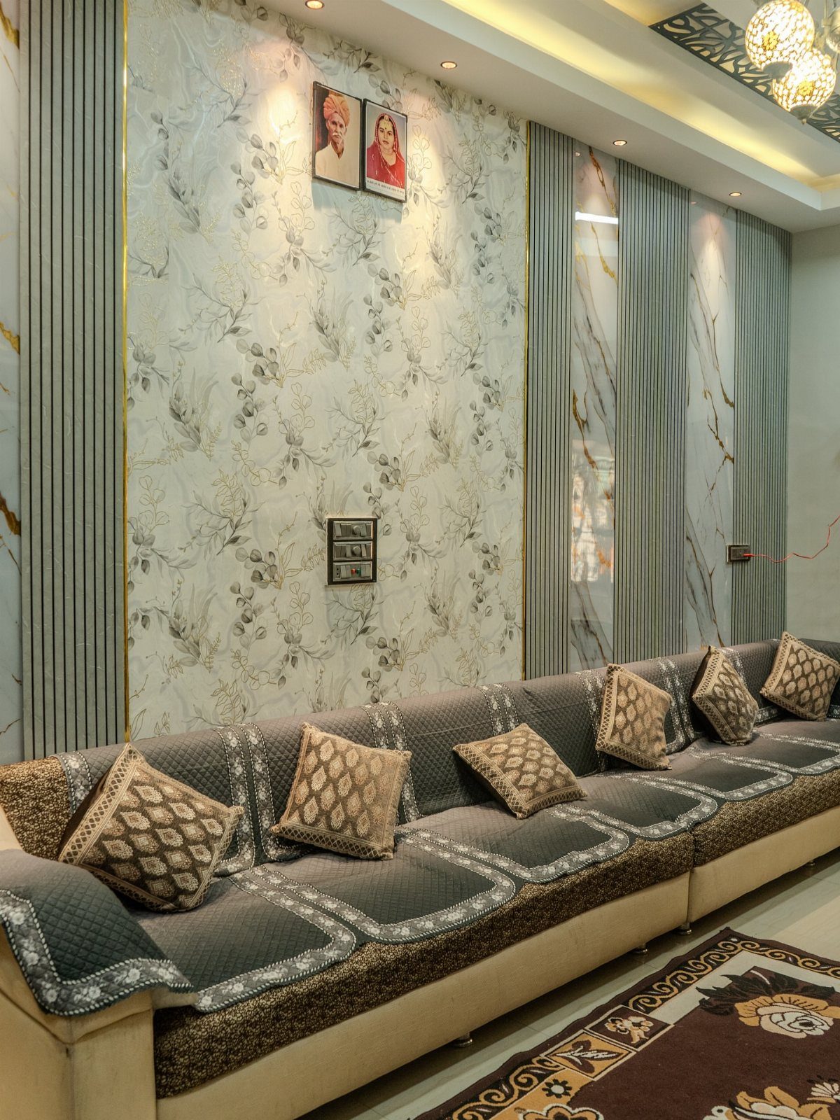 Decorative living room wall with floral panels and grey fluted PVC wall designs.
