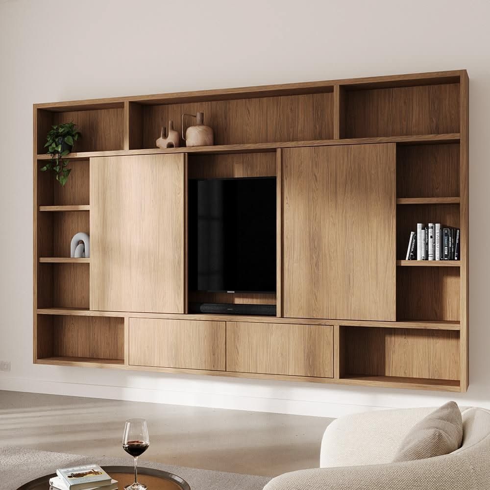 Large wooden wall-mounted entertainment unit with shelving and a television in a modern room.