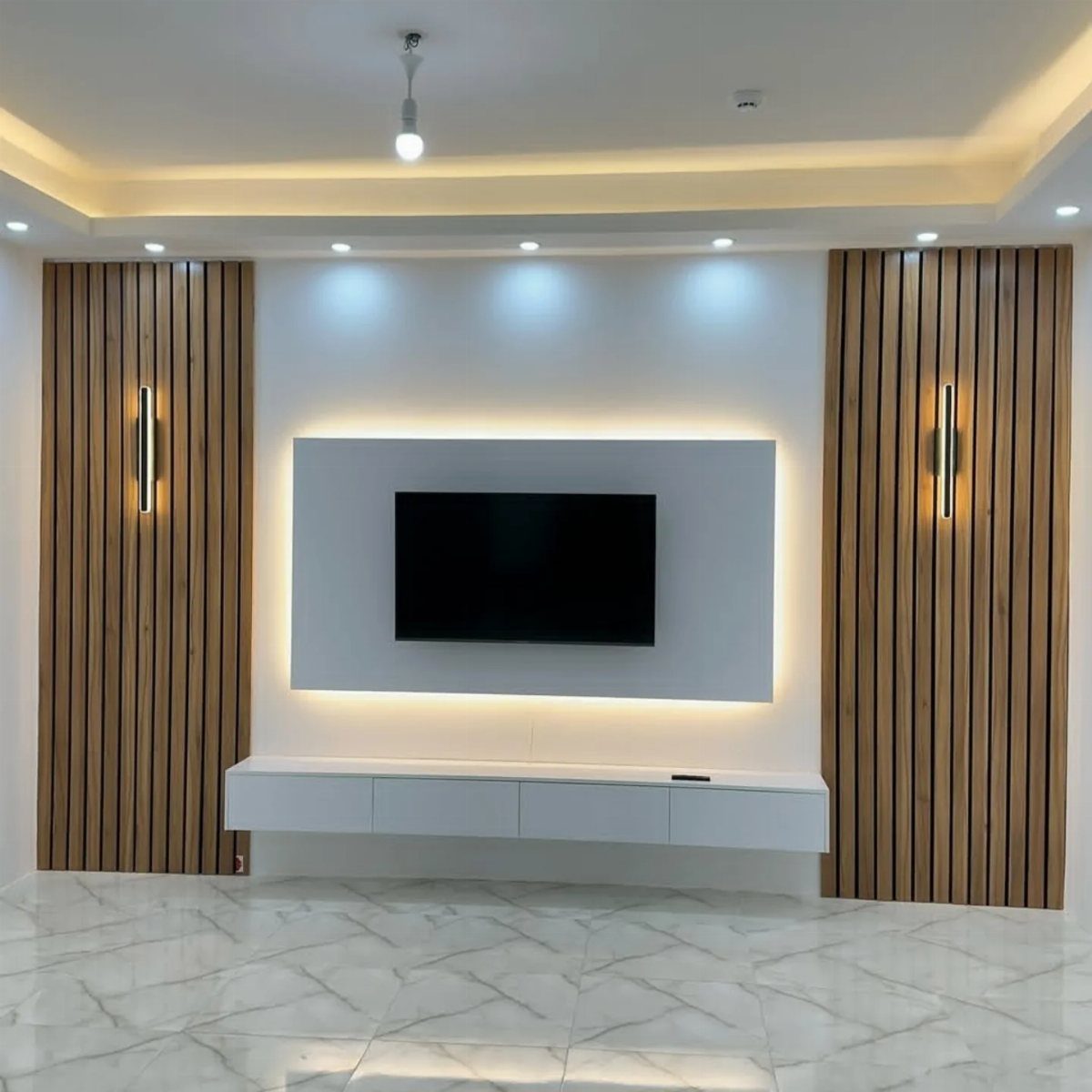 Modern TV unit with a white floating console and vertical wood slat wall panels.